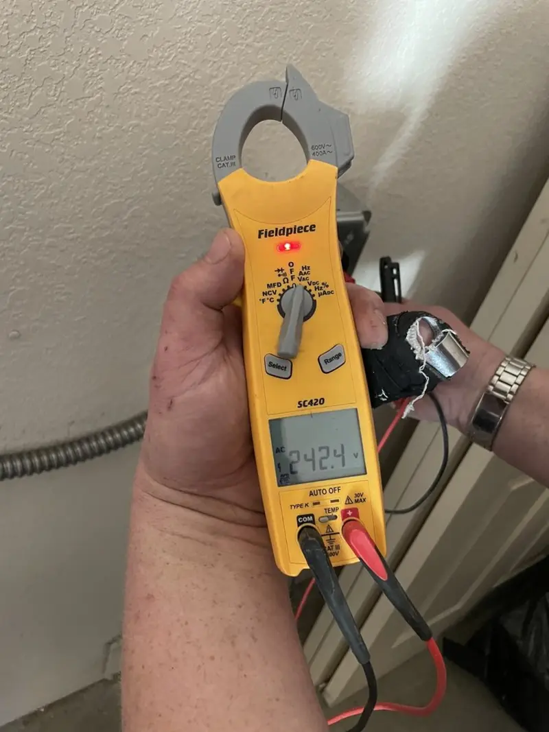 Voltage testing with clamp meter during Outlet Installation in El Mirage